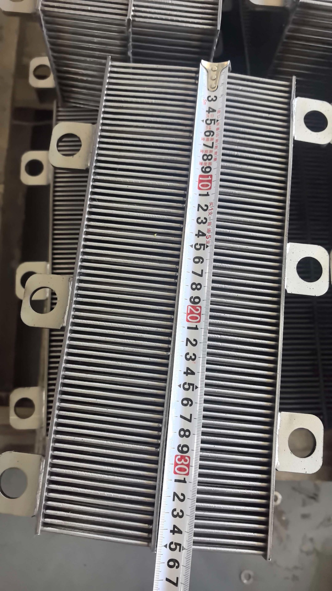 Tape measure aligned along the overall length of a matrix box